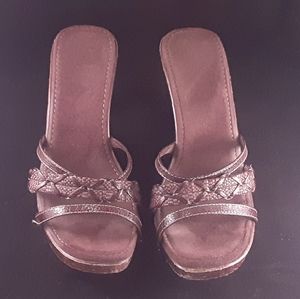 Brown unique wedge sandals with open back.